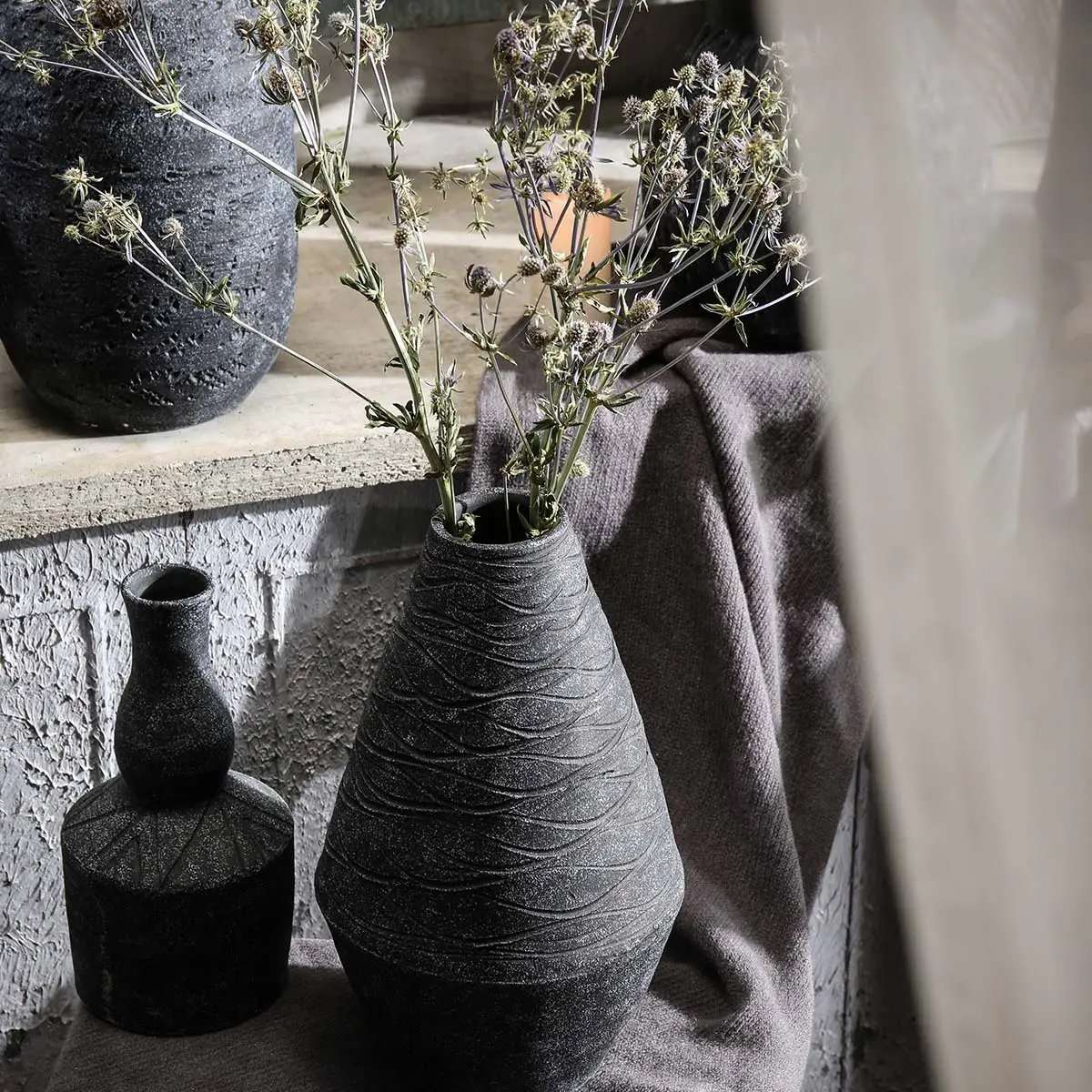 Surface details on textured ceramic vase products